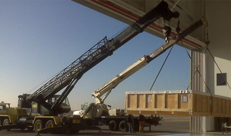 cranes lifting crate